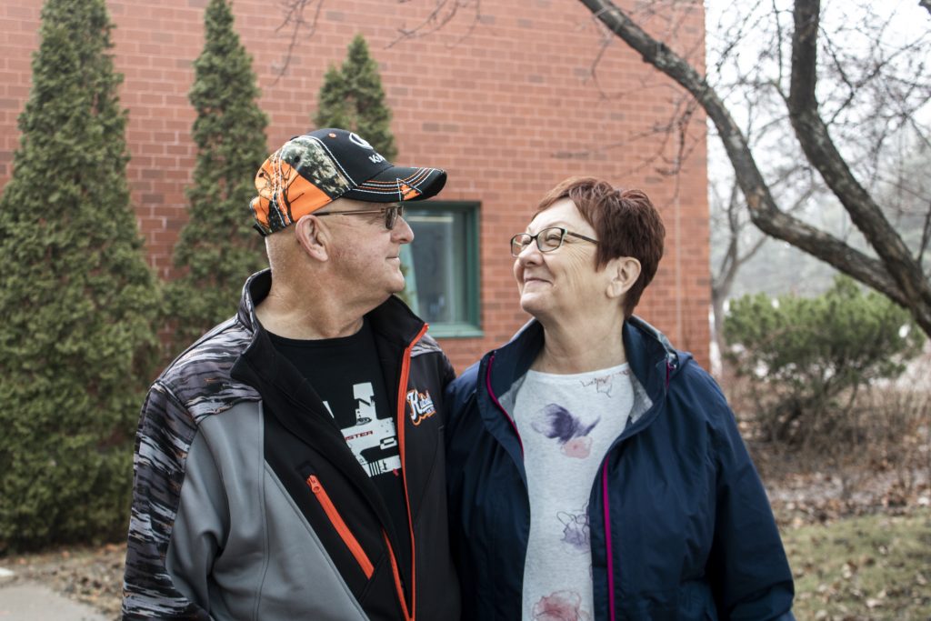 Photo of Colleen and her husband, reminiscing about her same-day knee replacement surgery and at-home recovery